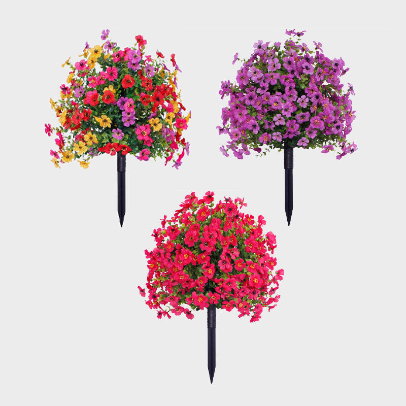 Kunstmatige eucalyptus en viooltjes als bloemdecoratie voor in de grond.