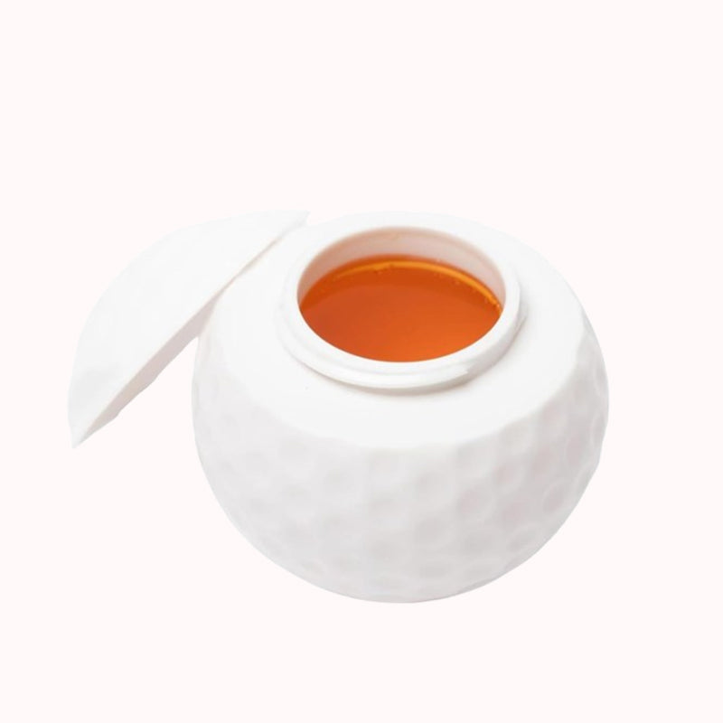 Creatief shotglas in de vorm van een golfbal